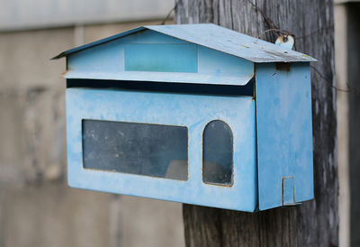 Close-up of mailbox on wood
