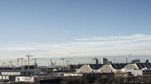 High angle view of buildings in city against sky