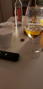 Close-up of wine glasses on table