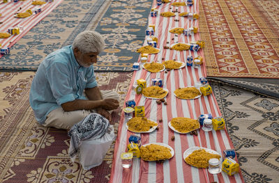 High angle view of man holding umbrella