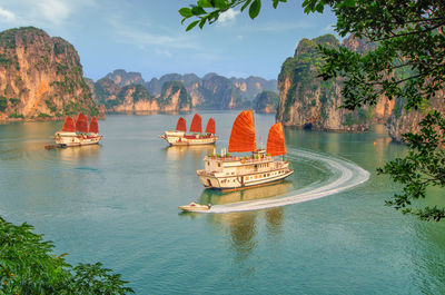 View of boats in lake against sky