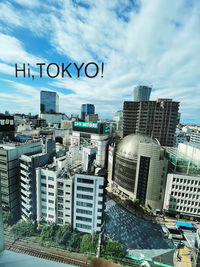 High angle view of buildings in city against sky