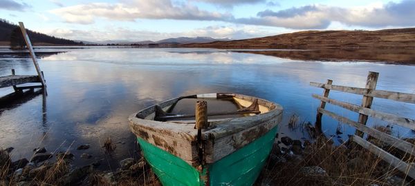 Boat moored in lake