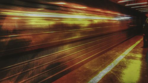 Blurred motion of train at railroad station at night