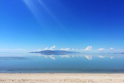 Scenic view of calm sea against cloudy sky