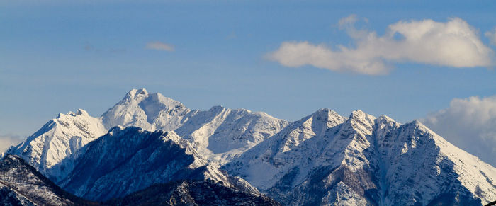 Scenic view of snowcapped mountains against sky