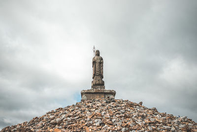 Low angle view of statue against sky