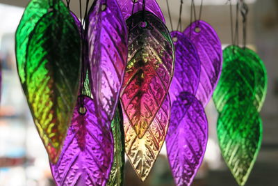 Close-up of multi colored decorations hanging in store