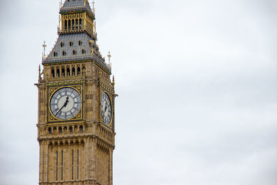 Low angle view of clock tower against sky