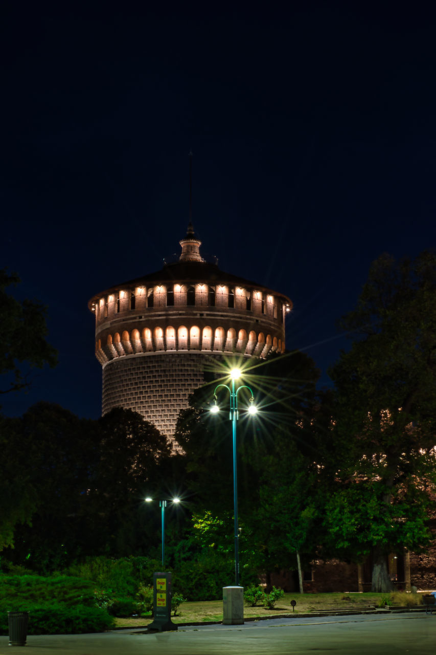 ILLUMINATED BUILDING AGAINST SKY