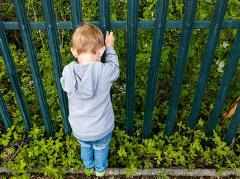 Full length of boy standing on grass