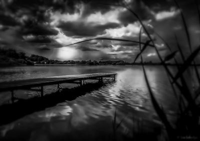 Scenic view of sea against storm clouds