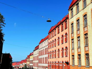 Low angle view of buildings against clear sky
