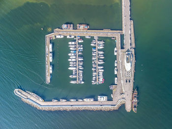 High angle view of information sign by sea