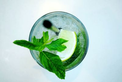 Close-up of green drink on white background