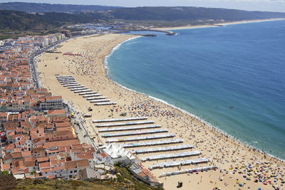 High angle view of townscape by sea