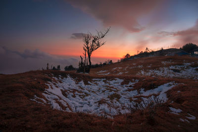 Scenic view of landscape against sky during sunset