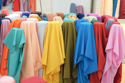 Close-up of clothes hanging in store