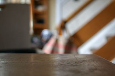 Close-up of man on table at home