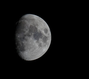 Low angle view of moon against sky at night