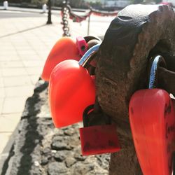 Close-up of red balloons hanging on metal