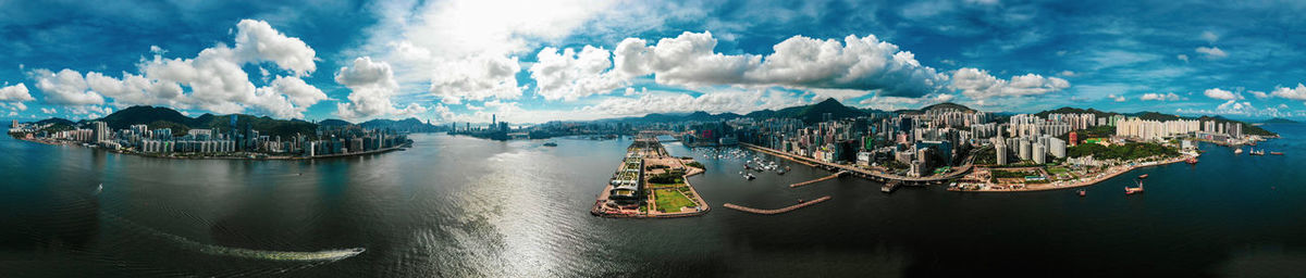 Panoramic view of sea and city against sky