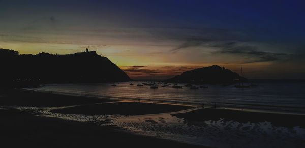 Scenic view of sea against sky at sunset