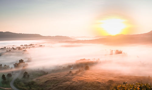 Scenic view of landscape against sky during sunset