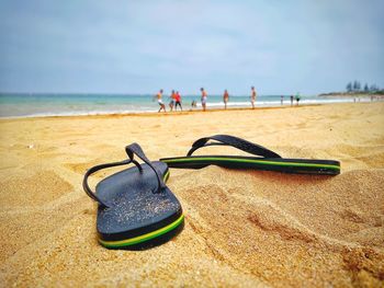 Close-up of people on beach