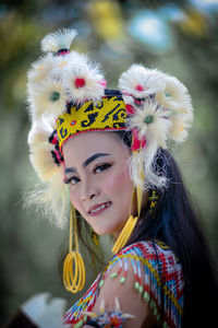 Portrait of smiling young woman in traditional clothing