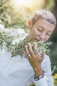 Midsection of man holding plant