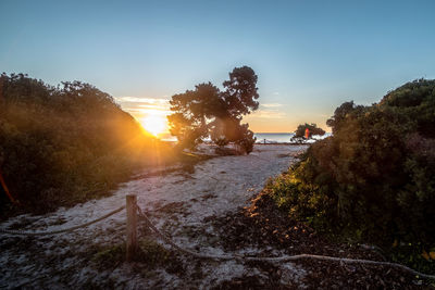 Scenic view of land against sky during sunset