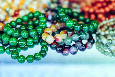 Close-up of multi colored bead on table
