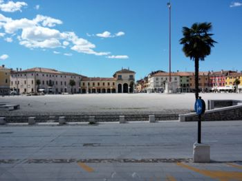 Buildings against blue sky and clouds