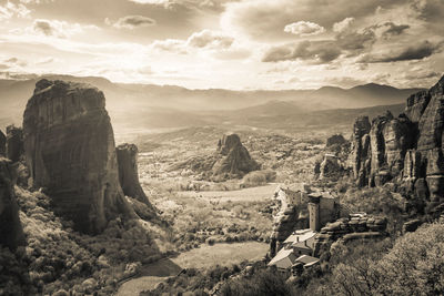 Scenic view of landscape against cloudy sky