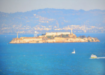 Scenic view of sea against blue sky