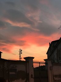 Silhouette buildings against sky during sunset