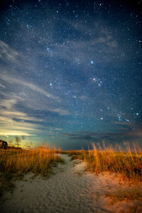 Scenic view of field against sky at night