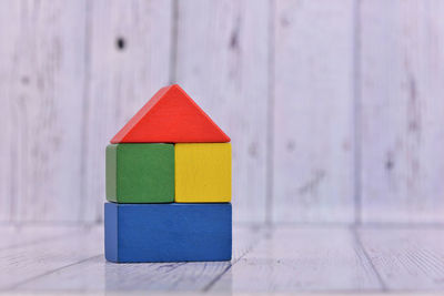 Close-up of multi colored toy on wood