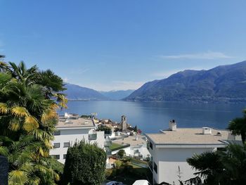 Scenic view of sea and mountains against sky