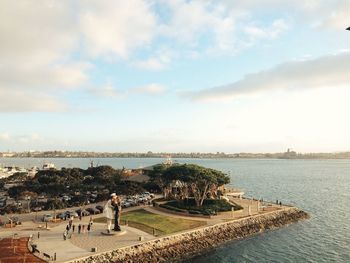 Unconditional surrender sculpture by san diego bay against sky