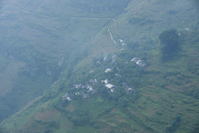 High angle view of land amidst buildings on field