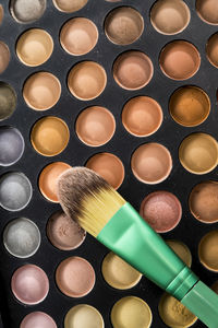 Close-up of eyeshadow and brush