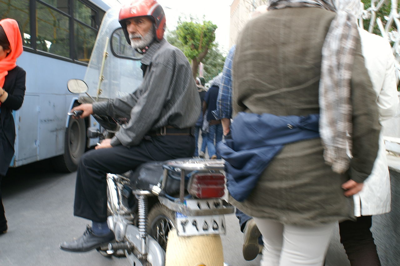 REAR VIEW OF COUPLE ON STREET