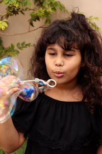 Girl bowling bubbles