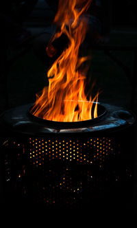 Close-up of fire burning at night
