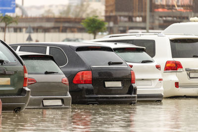 Row of cars on street in city