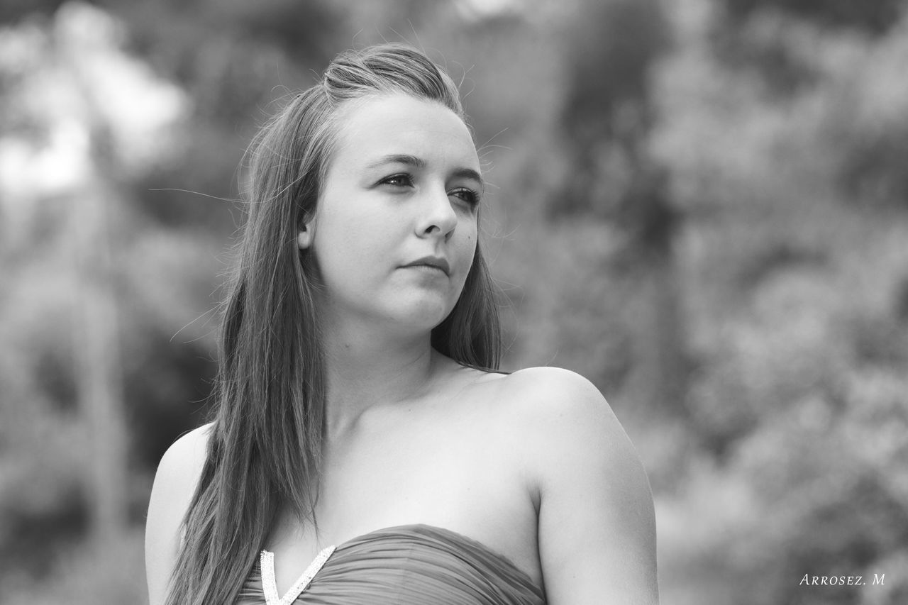 YOUNG WOMAN LOOKING UP