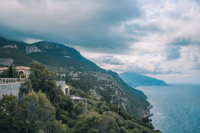 High angle view of townscape by sea against sky