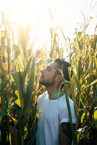 Young man standing in field